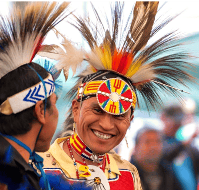 Men in regalia at powwow