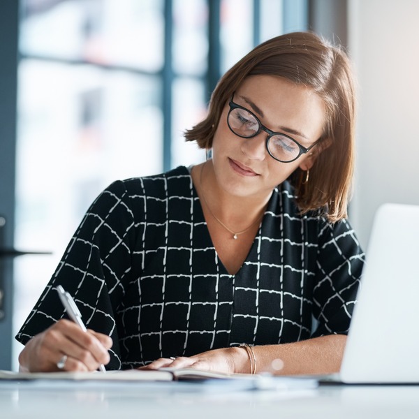 Office, woman and laptop writing